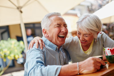 Laughing elderly couple